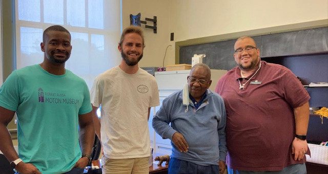 Moton Museum Interns and Staff share a photo with Moton Council Member Emeritus Charlie Taylor.