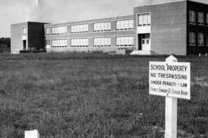 A sign in front of Robert Russa Moton High School, posted by the Prince Edward County School Board, states "No Trespassing."